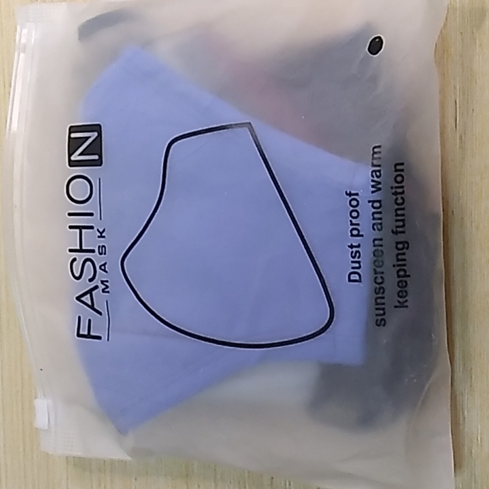 5 pack of Adult Face Masks with adjustable sides for your ears, wire in the nose